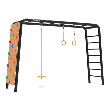 BERG Playbase Wooden disc swing shown with the rings and climbing wall on a large playbase.