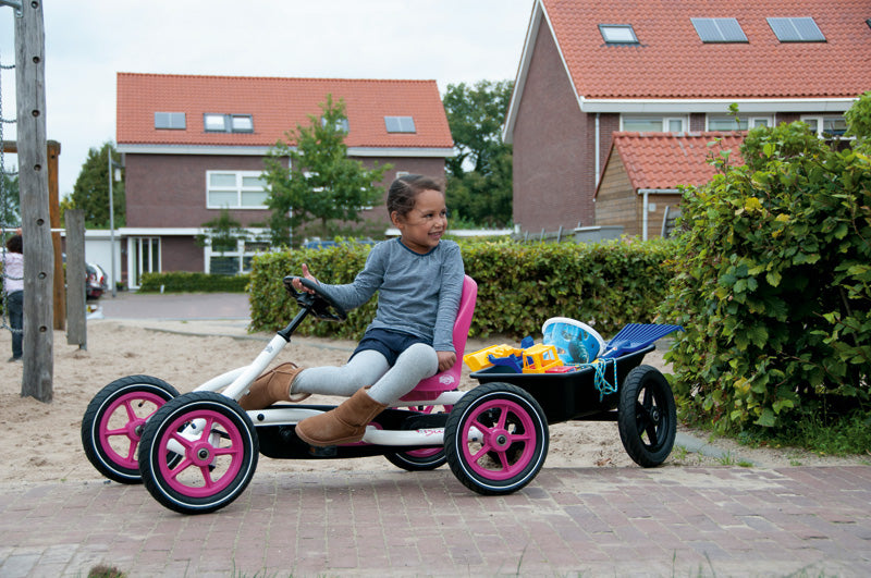 BERG Junior trailer attached to the Berg Buddy Pink - Go Kart and other items are not included with the trailer.