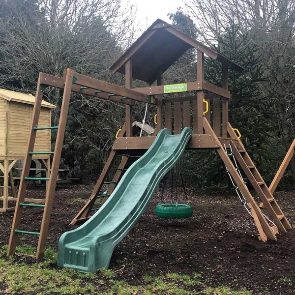 Northbridge tower with Monkey Ladder, 3m (10ft) slide, rock wall with knotted rope, chain climber, 360 degree tyre swivel swing and access ladder with flat treads.